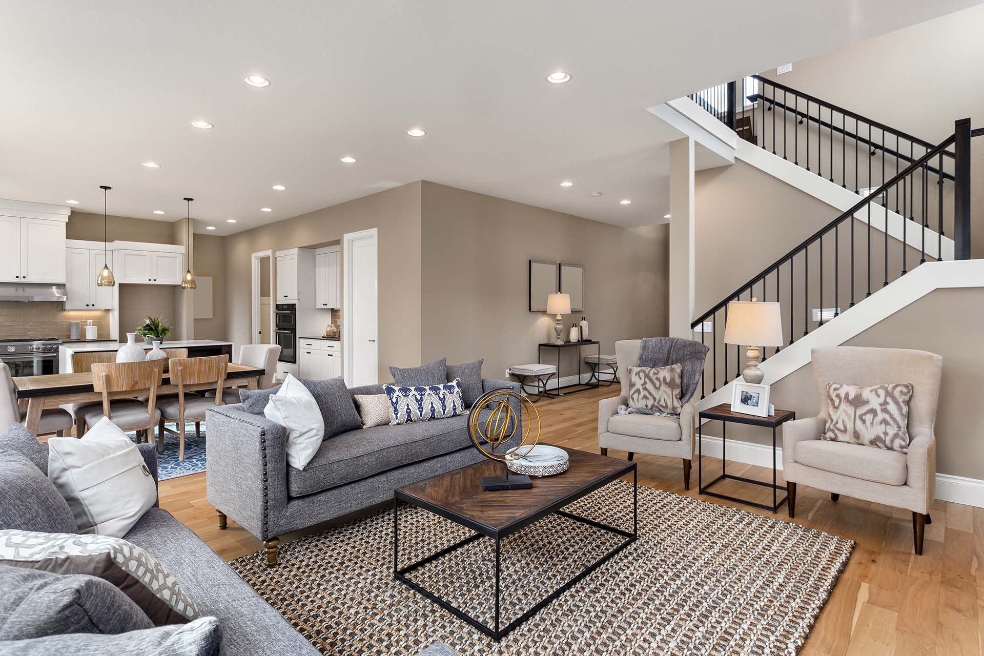 Living room and kitchen interior in new home with open concept flooring