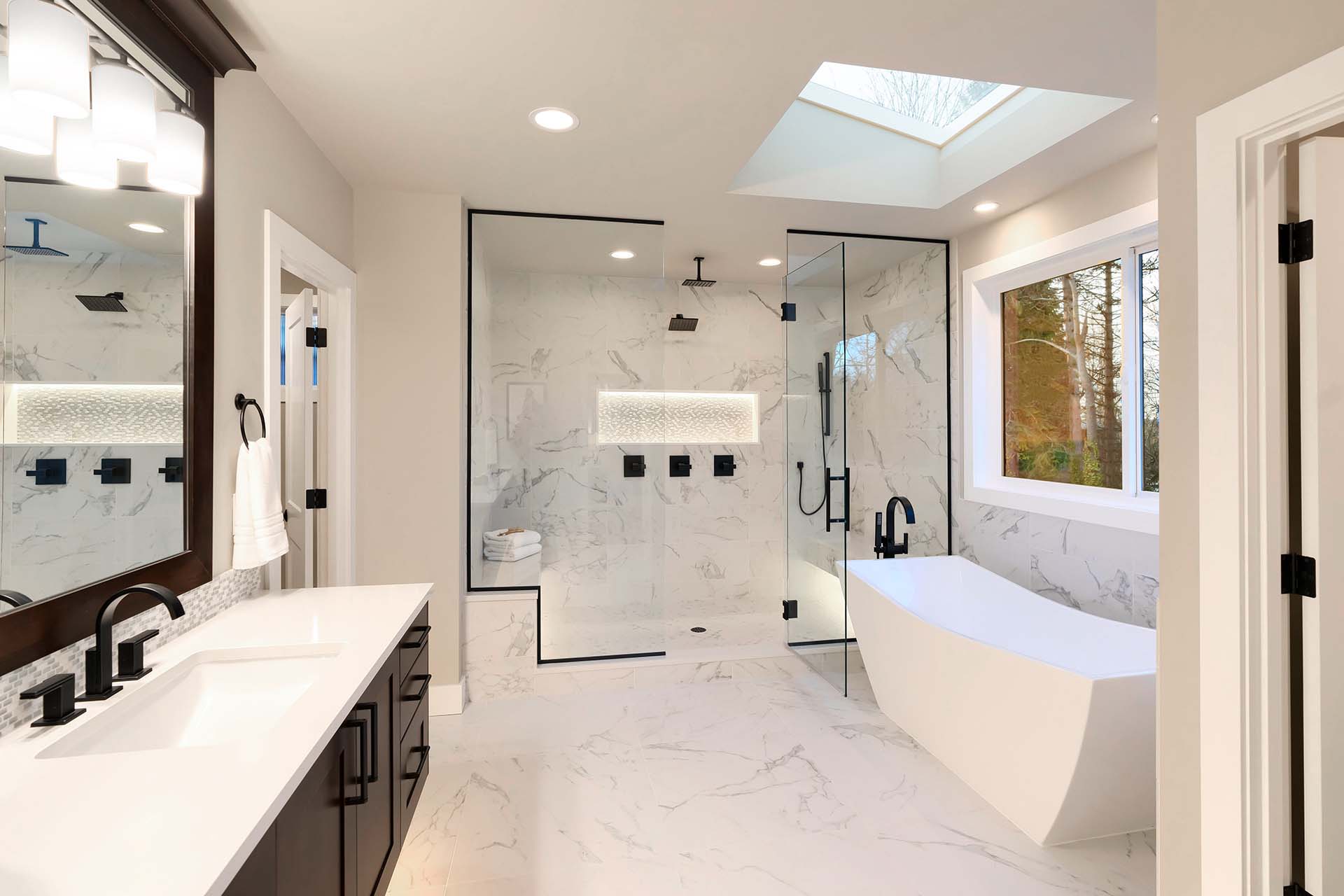 Luxury modern home bathroom interior with dark brown cabinets.