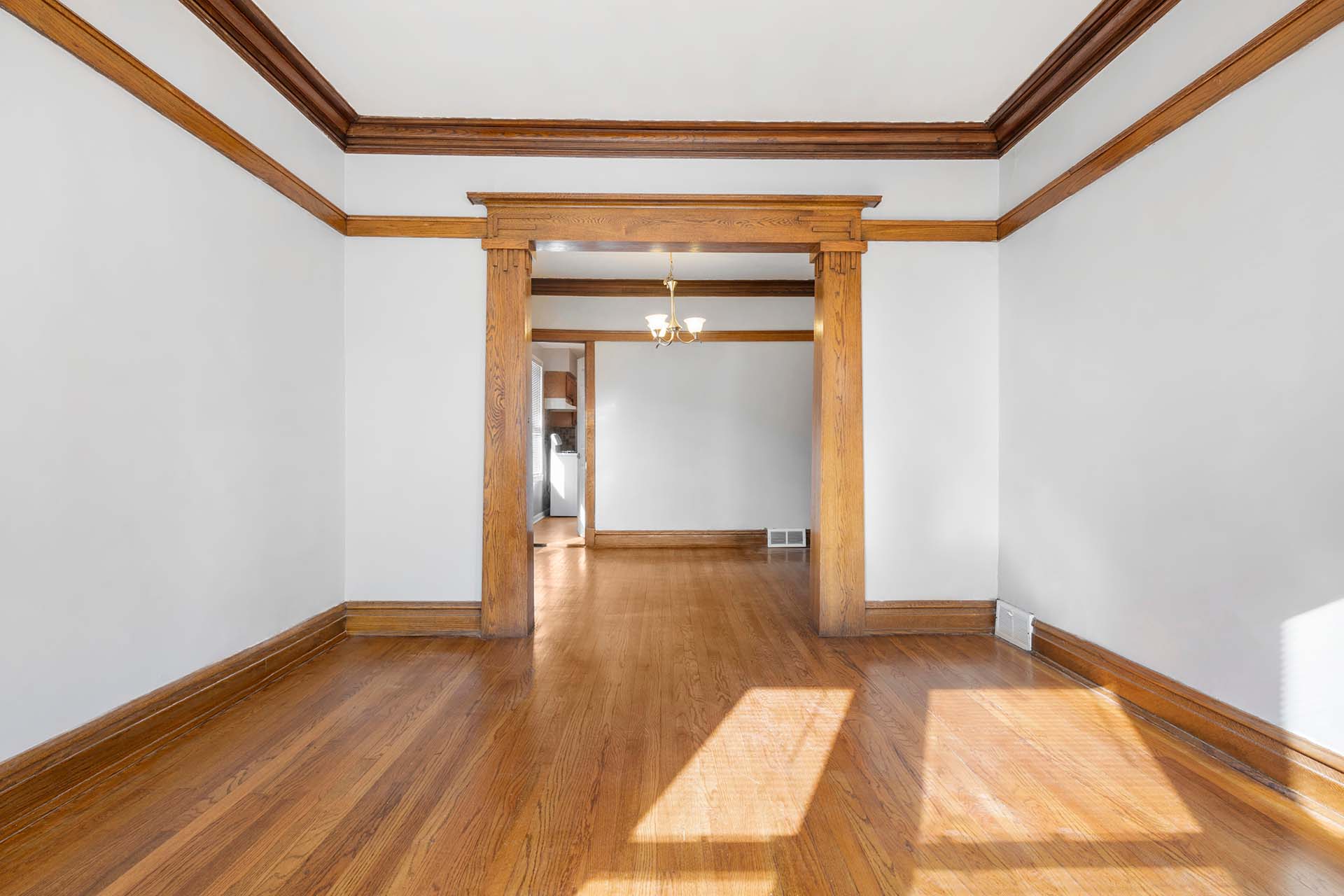 Vintage Living Room with Hardwood Floors. White walls with vinta