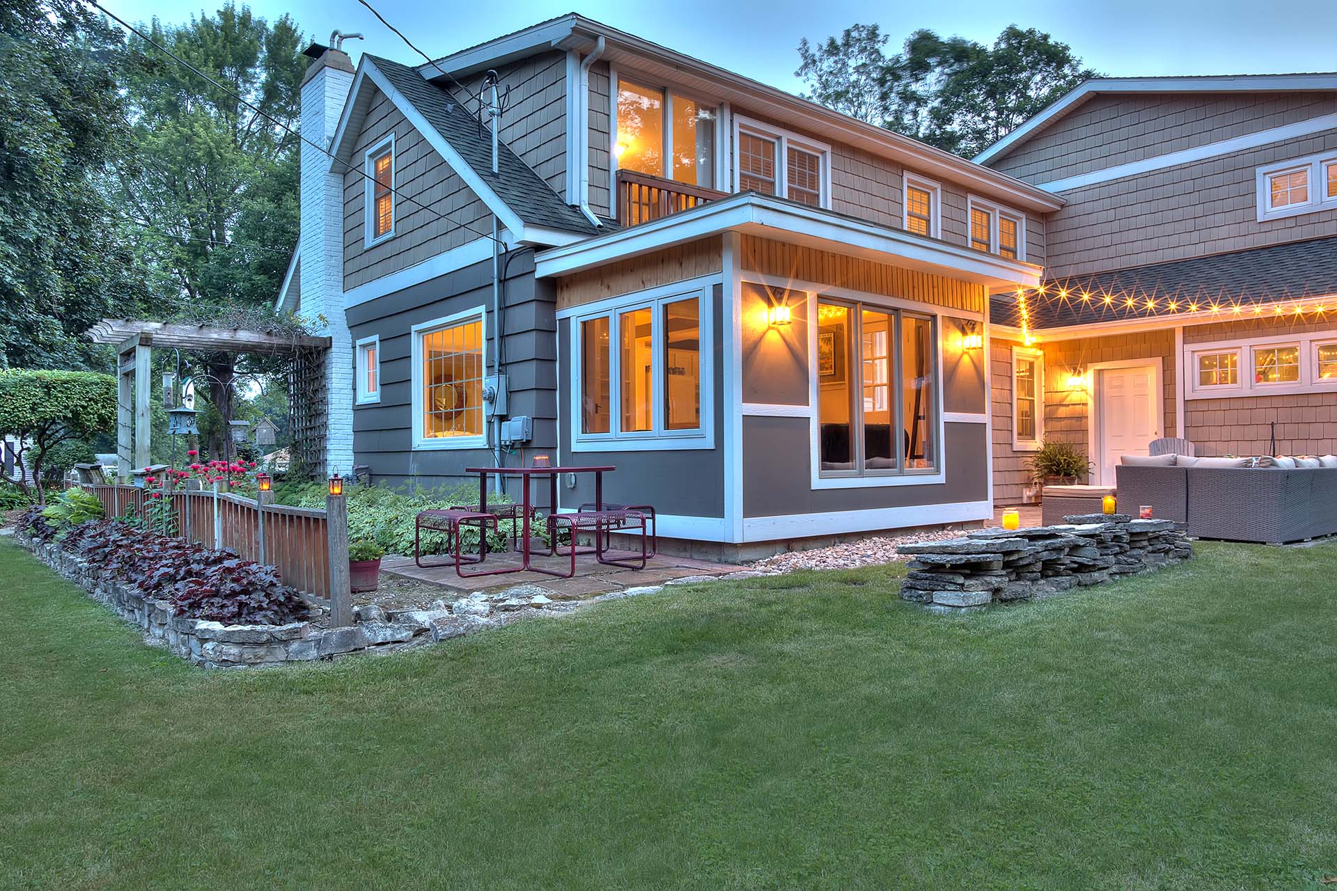 Beautiful restored Cape Cod style house exterior at dusk