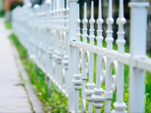 A close-up of white fences showcasing their design and structure, ideal for exploring different types of fencing.